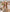 Quiet luxury resort capsule wardrobe item featuring a flat top natural color woven hat