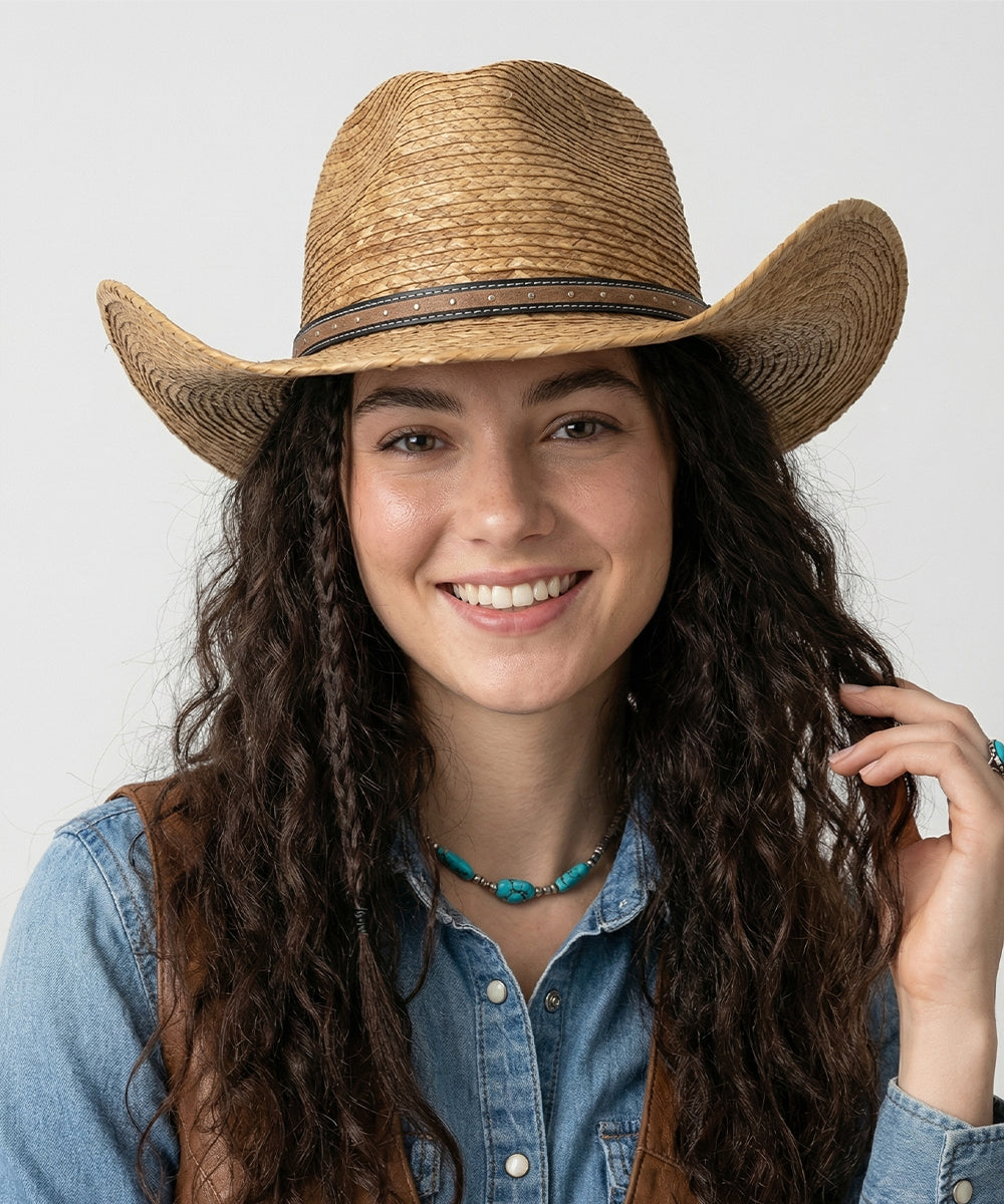 Bohemian festival cowgirl look wardrobe capsule styled with a dark brown straw cowboy hat
