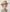 Cinematic frontier lookbook wardrobe styled with a rustic brown woven cowboy hat