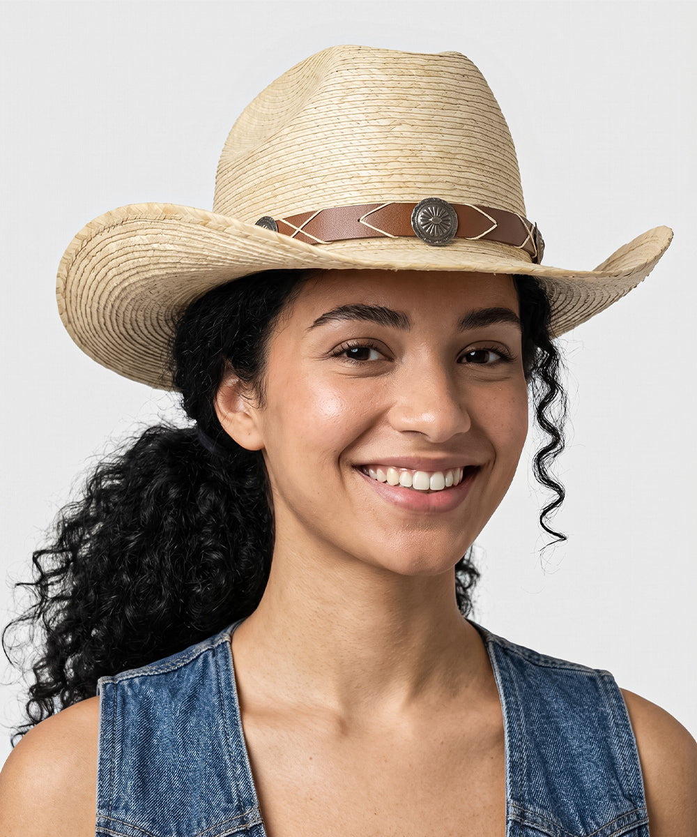 Women's summer festival outfit ideas styled with a natural ivory straw cowboy hat