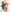 Premium boutique holiday wear trends displaying a natural beige woven straw protection hat